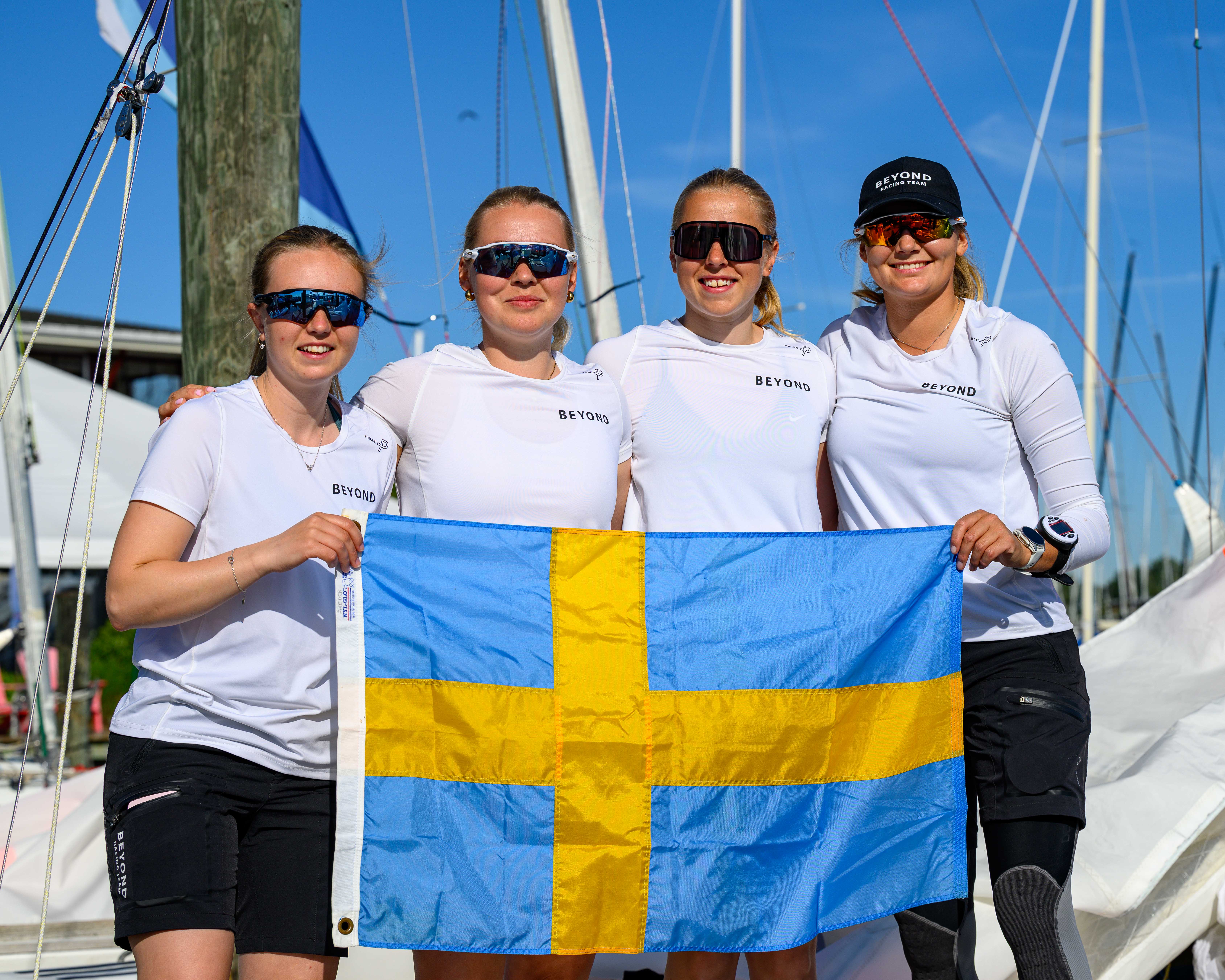 Team holding the Swedish flag